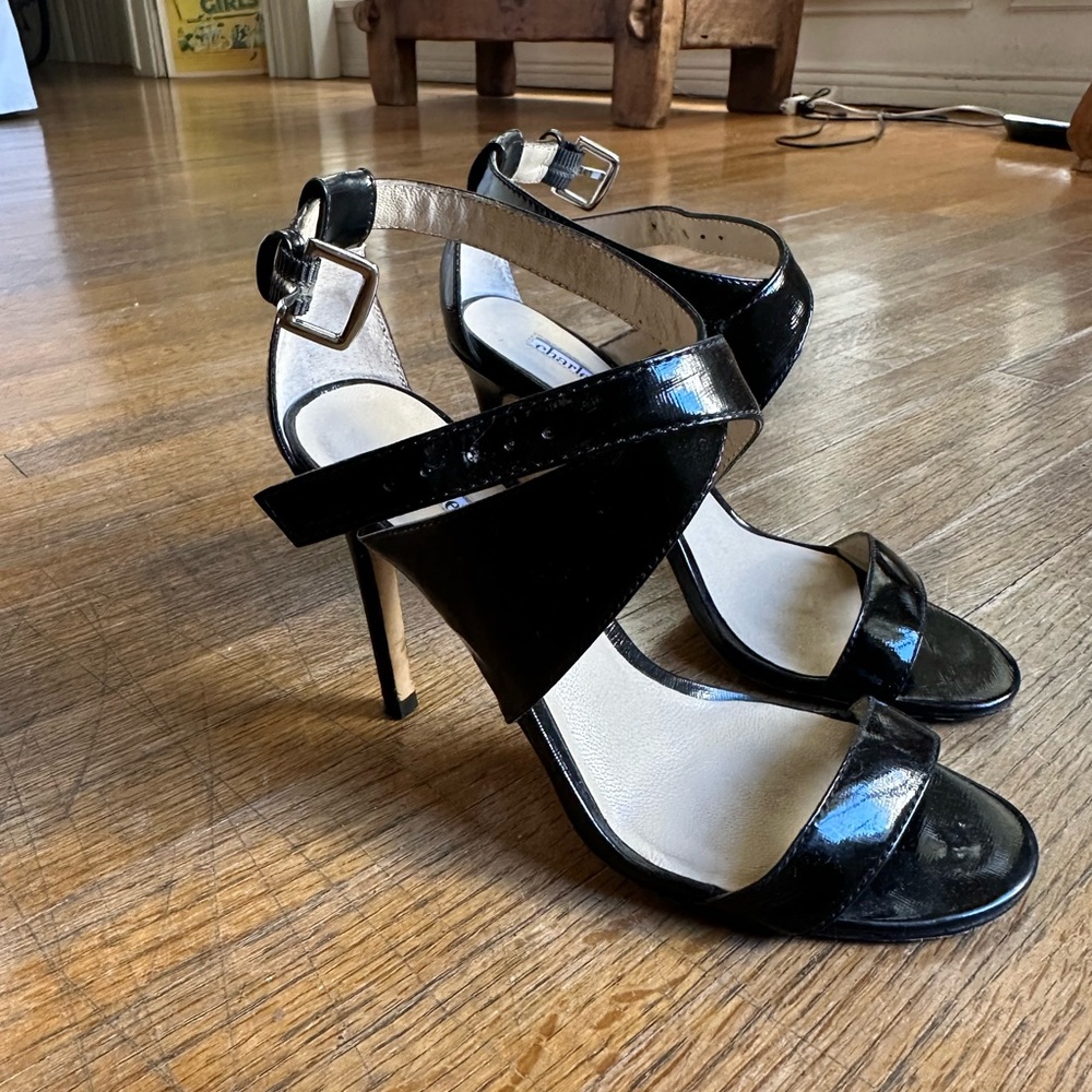 Charles David black patent leather open toe strapped high heel sandals.